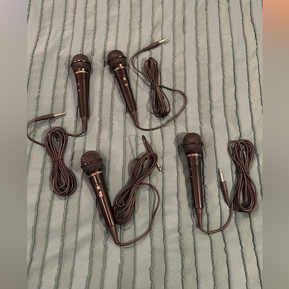 FOUR (4) QFX wired microphones. Never used!